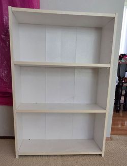 Small white bookshelf.