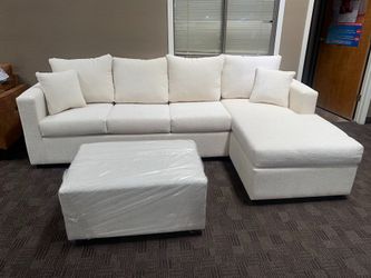 Custom cream sectional and ottoman! 