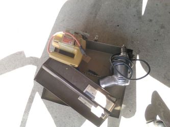 A drill a saw and a tool box