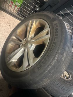 18 inch oem rim with tire for a 2013-2019 ford taurus