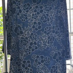 A Long Blue Flower Dress With Long Sleeves 