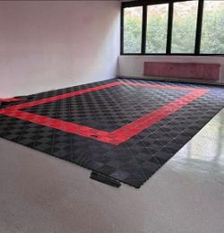 Heavy duty interlocking floor tile.