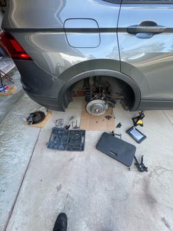 Rear Brake Caliper with Rotor and Coil Spring