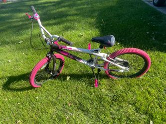 This is a 20" Kent Tempest BMX bike with a pink, black, and white design