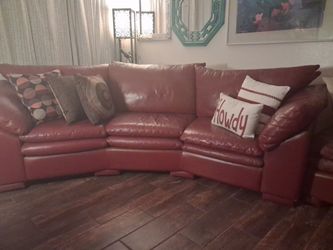 Genuine Leather. Deep Red  sectional. Had less than a year. EXCELLENT CONDITION