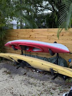 2 AMAZING KAYAKS + STAND BUNDLE (1 YELLOW SUPER LONG PROFESSIONAL KAYAK + 1 PELICAN RED WHITE KAYAK) + PADDLES!!!