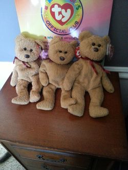 3 tan colored beanie baby bear's