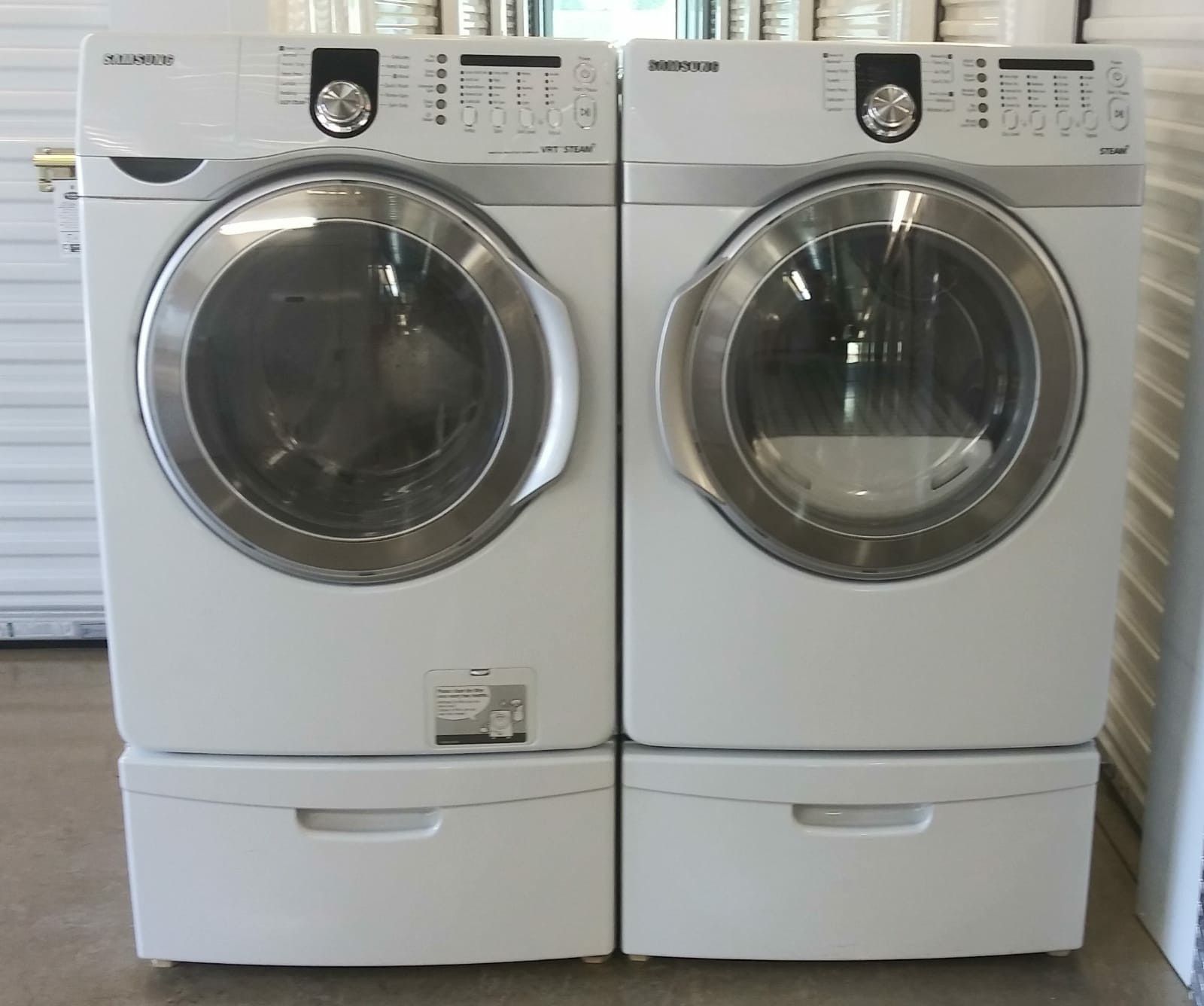 SAMSUNG FRONT LOADERS WASHER AND DRYER ON PEDESTALS for Sale in
