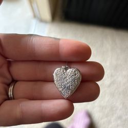 Silver locket $200