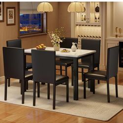 Set of 6 dining chairs.  Brand new in box, leather