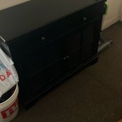 Cabinet with drawer and display shelves on bottom with glass doors
