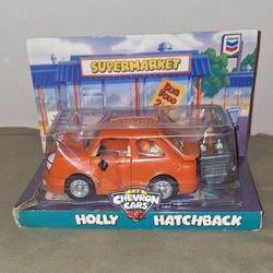 Chevron Cars 1997 Vintage Holly Hatchback Orange Toy + Dog in Shopping Cart - NIB