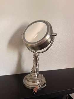 Double sided mirror with light