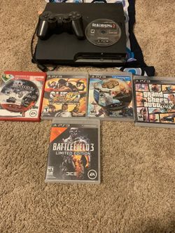 PS3 with controller and games