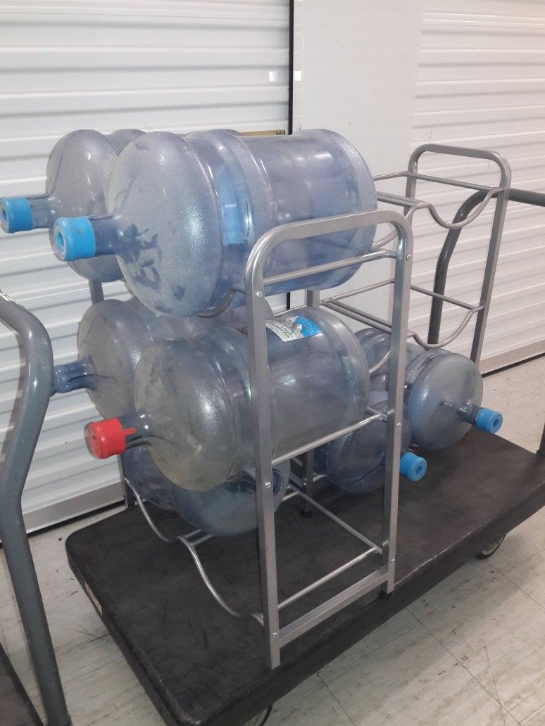 ** EMPTY 5 GALLON WATER JUG BOTTLES, CAPS, AND WATER JUG STANDS