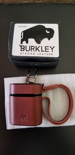 Burkley Strong Leather Case Fits Airpods 1st and 2nd Gen. No need to remove the case for charging. Hand strap included. Belt Clip Attached.