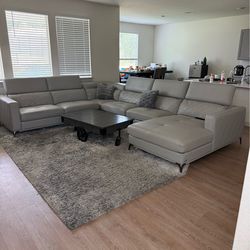 Sectional sofa with carpet and coffee table