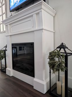 White farmhouse fireplace with mantle