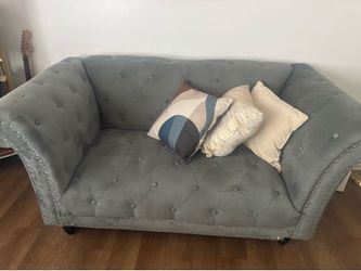 Couch set with pillows and pictures