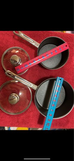 CA.  2 T-FAL ARMARAL POTS/PANS. HEAVY DUTY.