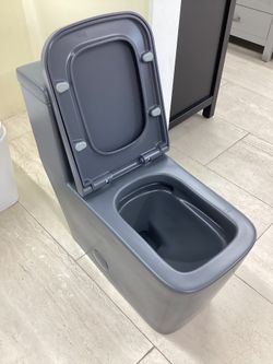 One Piece Grey Toilet New Fully Skirted With Softclose Seat Dual Flush System Square Modern Design Ready for Pick Up Today. 