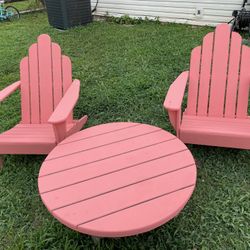 3 piece patio set. 2 wooden Adirondack chairs 1 composite wood table