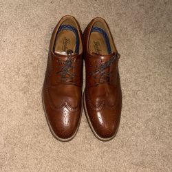 Dress Shoes And Books And Belts 