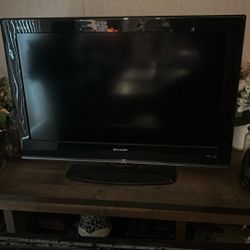 the Brand Is Sharp And Its A 42inch Tv Black Color