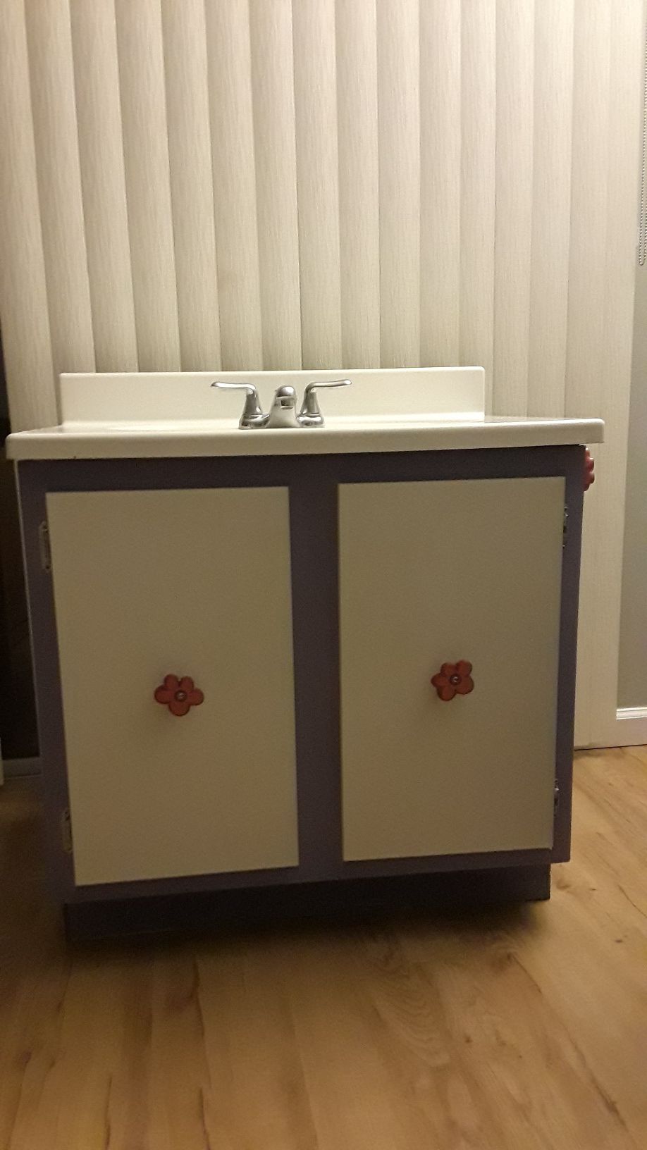 Bathroom cabinet with sink and faucet