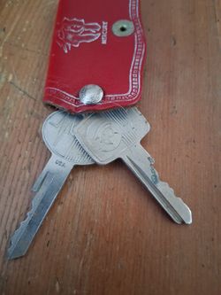 This vintage red leather key fob is from Boyer Motors, Inc., located at 4150 Market Street in Riverside, California
