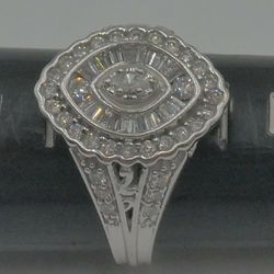 14kt white gold engagement ring 4.8 grams size 7 w 1 carat of diamonds total . 1 marquise diamonds approximately 0.10-0.12 pts ; 2 round diamonds 0.05