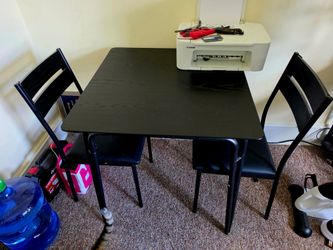 Double recliner loveseat, loveseat couch, and black dinning room table and 2 chairs.