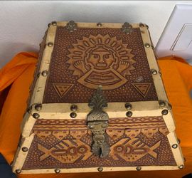 A Peruvian Leather-Wrapped Wooden Chest.