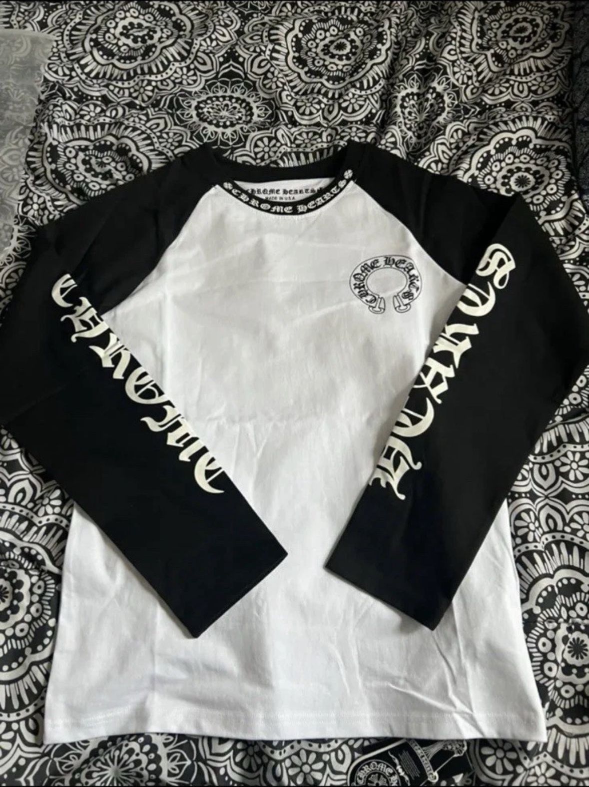 The Chrome Hearts Men's Long Sleeve Black and White Shirt is a stylish and versatile addition to any man's wardrobe. Made of comfortable cotton jerse