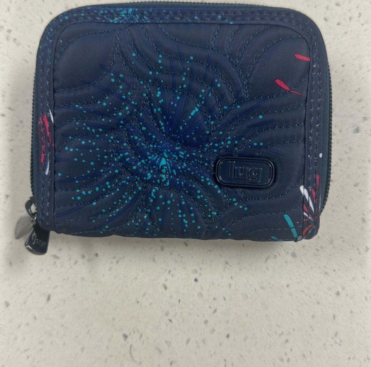 New without tag Lug Splits Compact RFID wallet with fireworks pattern.