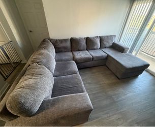 2 piece grey sectional w/ movable chaise