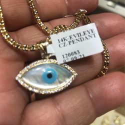 14 karat solid gold evil eye pendant with a 16”moon stone and turquoise including Beautiful Gold icy chain
