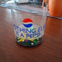 Vintage Pepsi-themed plastic cup featuring the slogan "Nothing Else Is A Pepsi". 