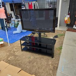 55" Panasonic TV And Glass Stand Shelf