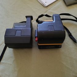 Two Polaroid Cameras