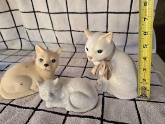 Vintage porcelain cats.