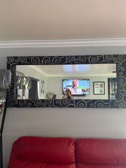 Accent Chair, Curio, Console, mirror and lamp Decor items.