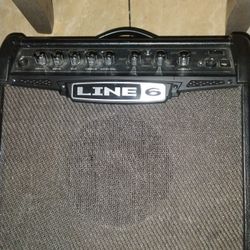 Line 6 Speaker And A Kona Electric Guitar 
