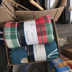 Box of brand new fleece blankets