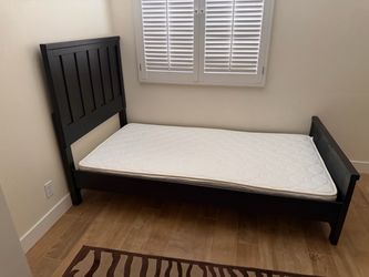 Twin bed with mattress and board