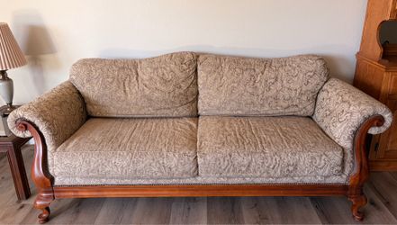 Couch with wooden legs