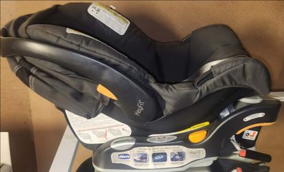 Chicco KeyFit 30 infant car seat in black mounted on its stay-in-car base