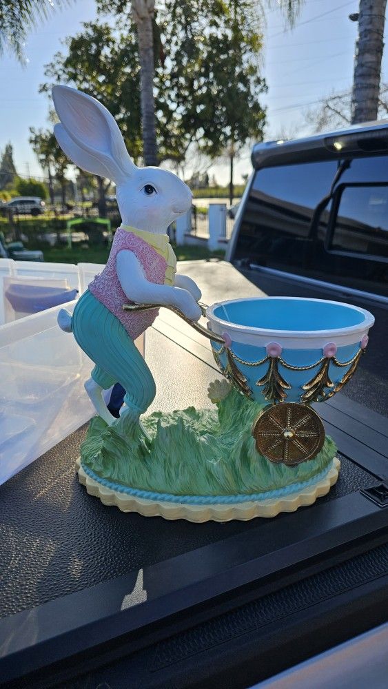 Cupcakes and Cashmere Bunny Pushing Egg Shaped Wheel Barrel" figure
