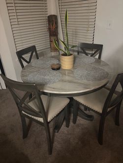 Round dining room table with chairs