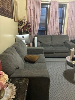 2 gray sofas in fair condition